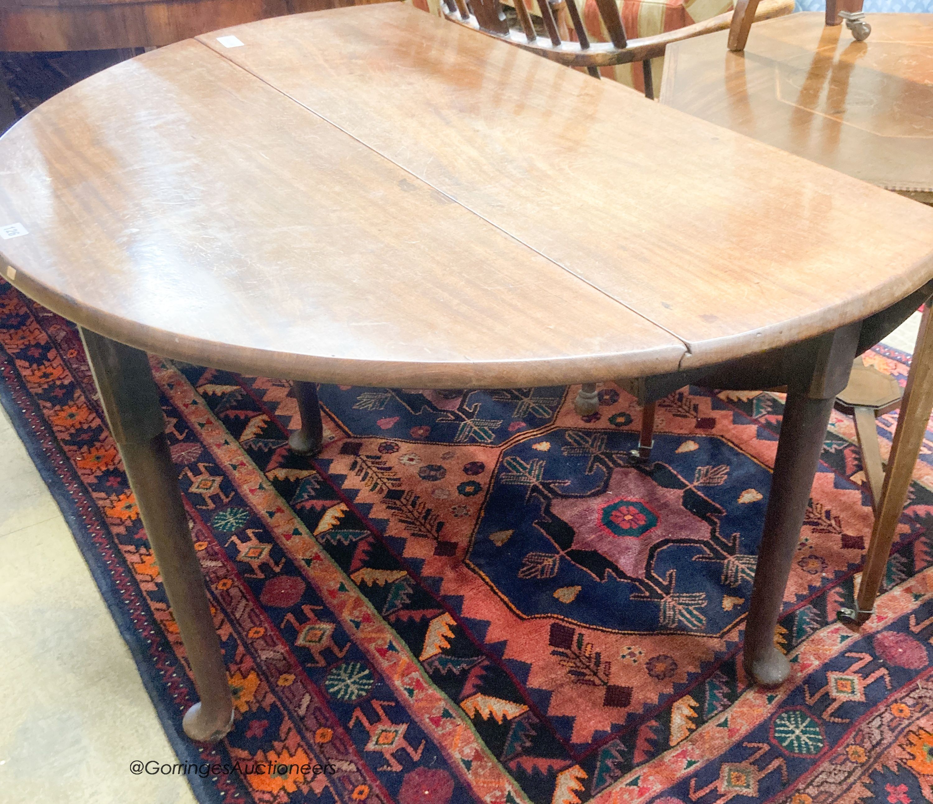 A George III mahogany pad foot drop leaf dining table, length 115cm extended, width 110cm, height 72cm